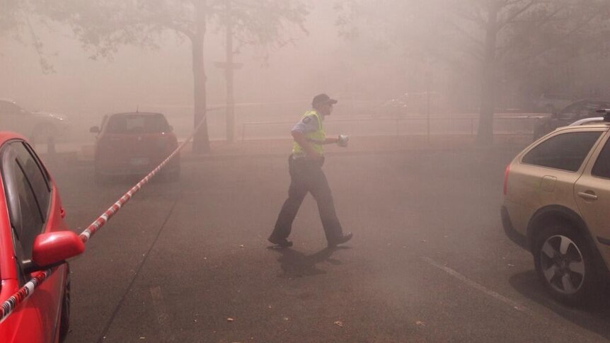 Fire crews passed out breathing masks to passers-by as heavy smoke covered the area