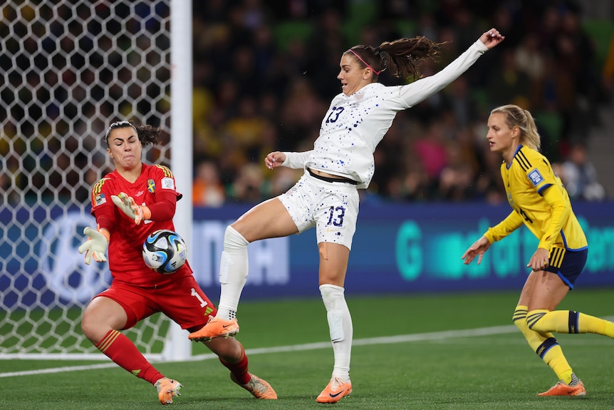 USA's Alex Morgan clashes with Sweden goalkeeper Zecira Musovic in the FIFA Women's World Cup.