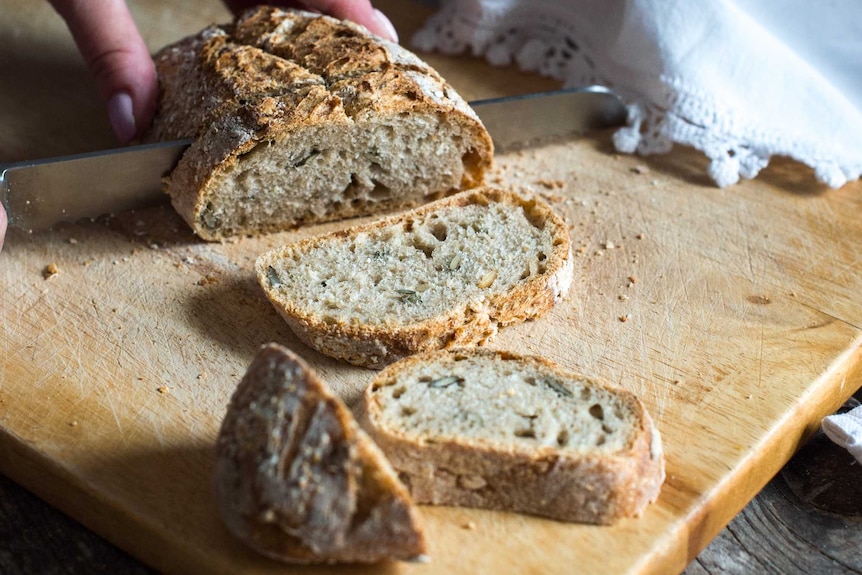 A sliced up loaf of bread.