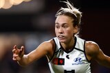 Keeley Sherar completes a kick during an AFLW games for Carlton.
