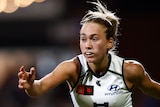 Keeley Sherar completes a kick during an AFLW games for Carlton.