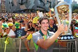 Mitchell Starc with the Cricket World Cup trophy
