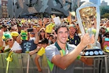 Mitchell Starc with the Cricket World Cup trophy