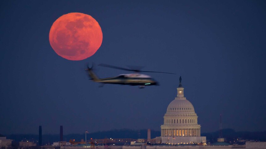 Full moon over US Capitol.