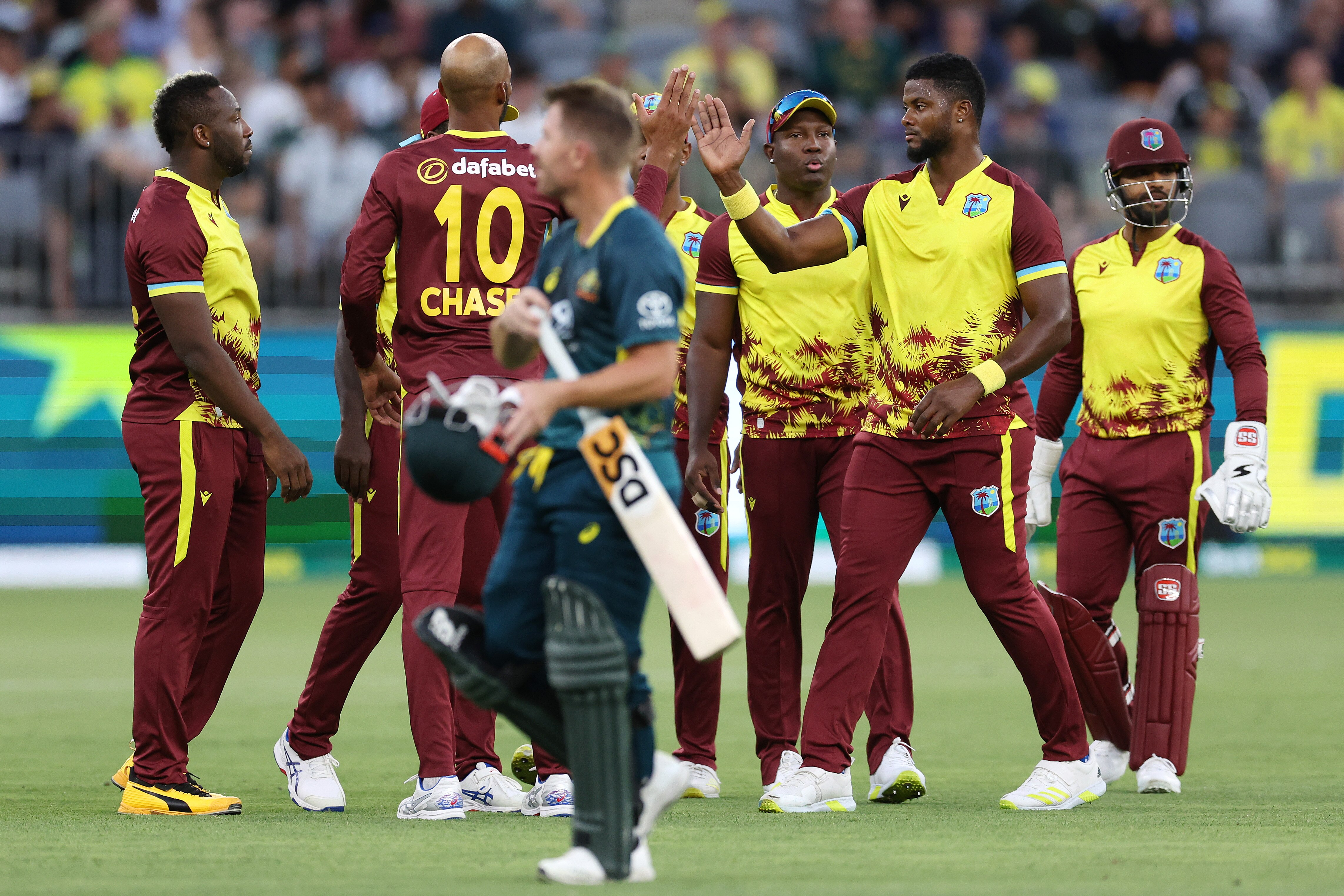 A man walks off after being dismissed in a cricket match
