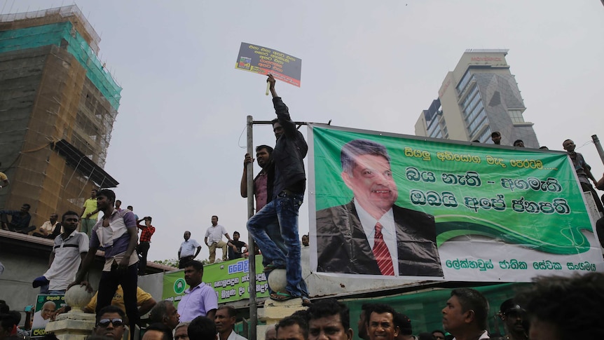 Supporters of Sri Lanka's sacked prime minister Ranil Wickremesinghe shout slogans denouncing president Maithripala