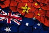 An Australian and a Chinese flag superimposed over cracked dirt
