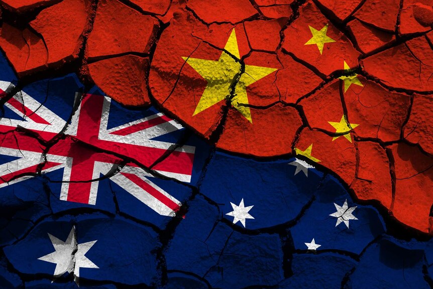 A composite of the Chinese and Australian flags on cracked ground.