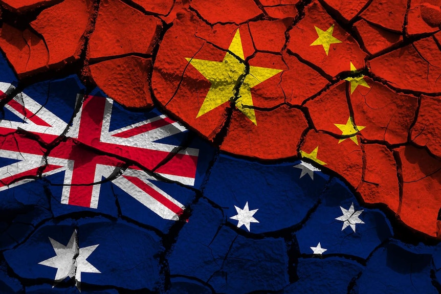 A composite of the Chinese and Australian flags on cracked ground.