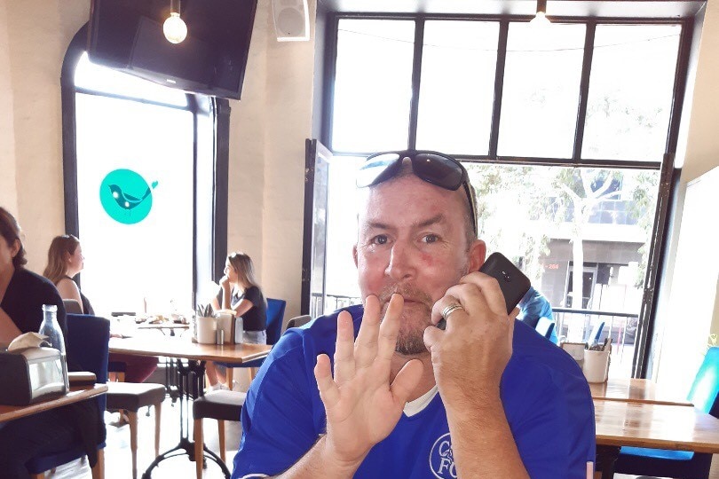 smiling man in cafe