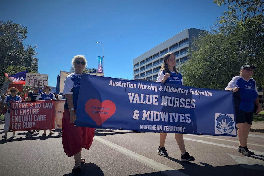 health workers march in darwin