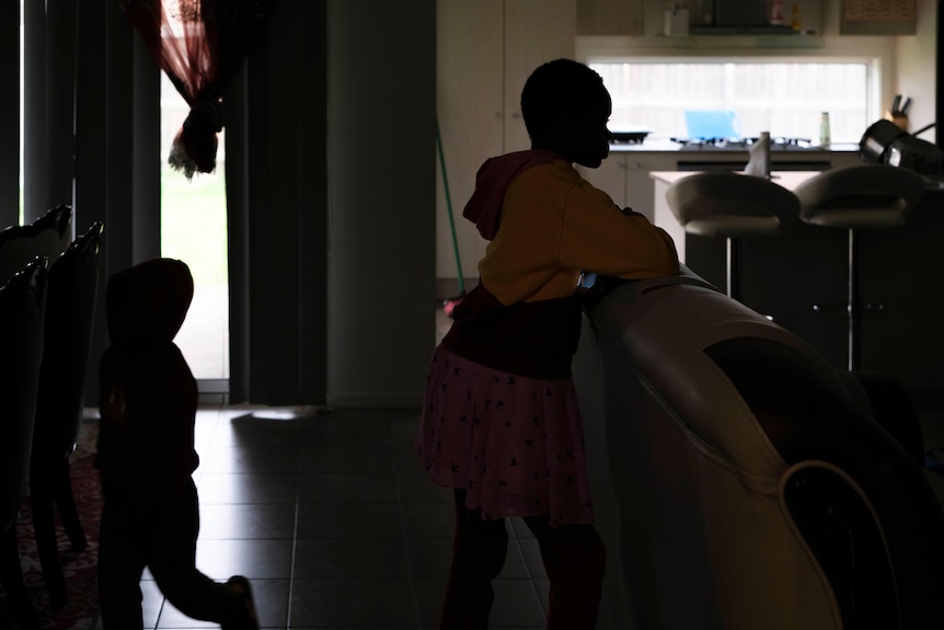 Silhouette of two children in a family home 