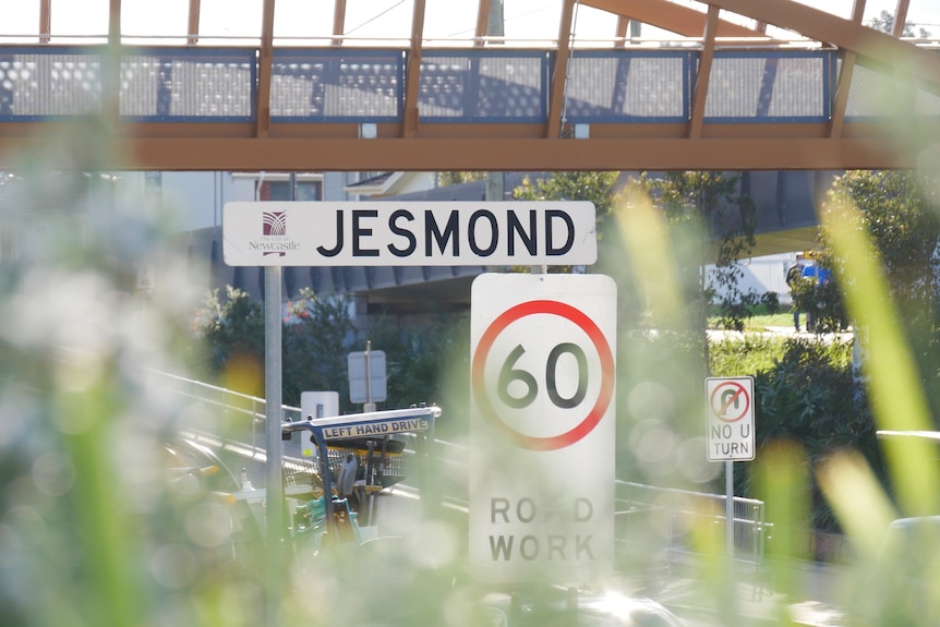 A road sign saying the suburb name "jesmond"