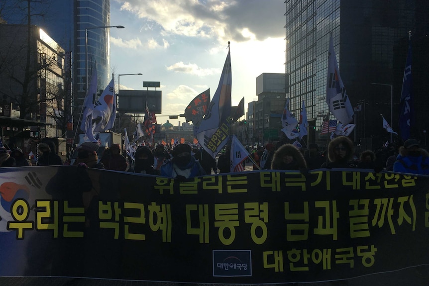 Protesters are angry about the South Korean government's embrace of North Korea in these Winter Games.