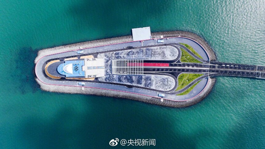 An aerial view of artificial island connected to the world's longest sea bridge.