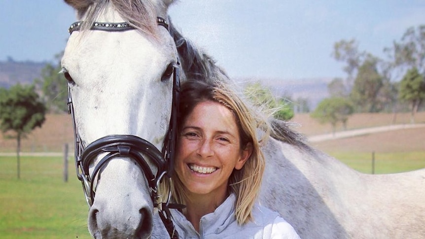 Linden Knight with her grey horse.