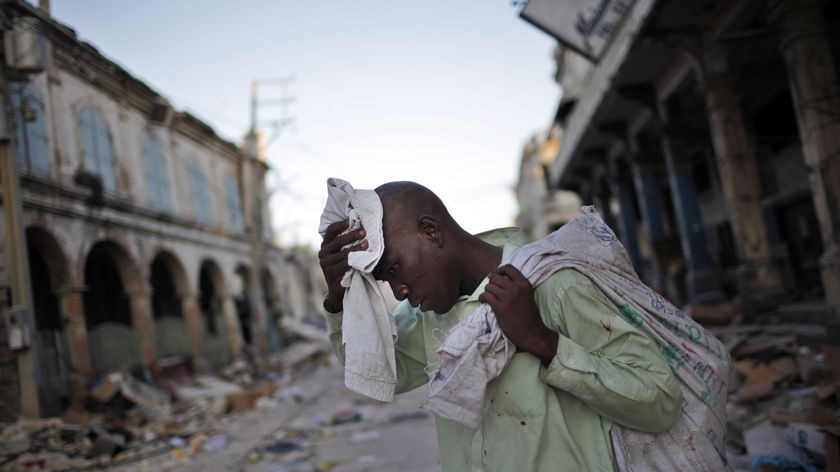 Man walks through destroyed Haiti street