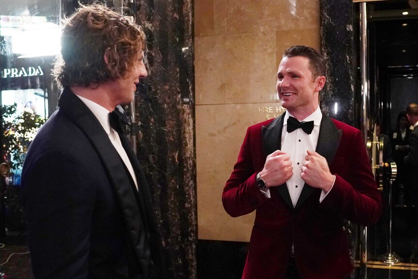 Nat Fyfe and Patrick Dangerfield are well dressed as they converse.