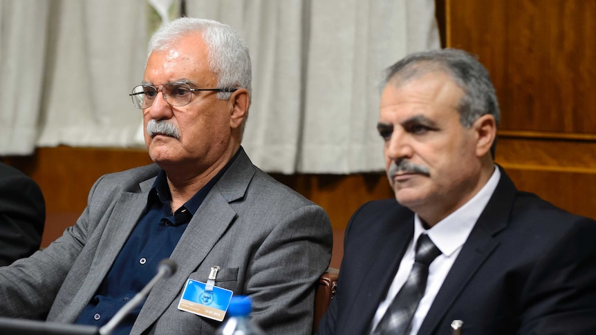 Members of the Syria's main opposition group attend peace talks.