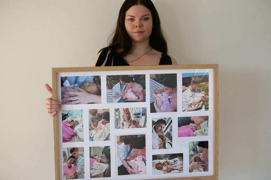 Chloe Stanley holds a large picture frame filled with pictures of her, her partner Ty and baby. 
