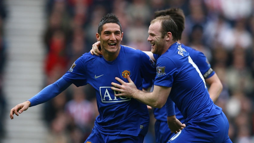 Federico Macheda (L) will don the hoops of QPR on loan from Manchester United