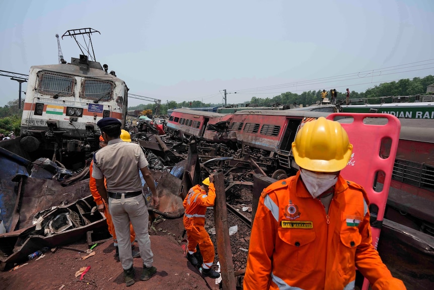 rescuers at india rail accident
