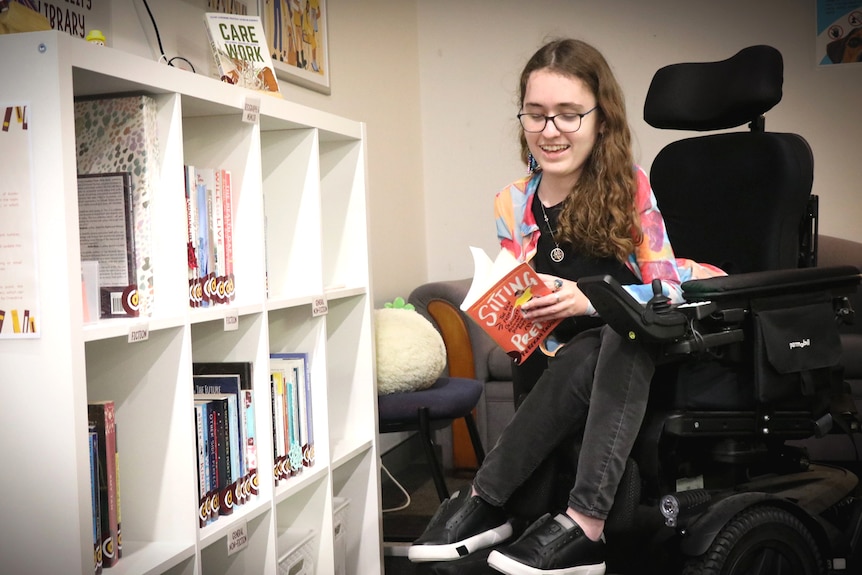 Disabled student Sophy Barlow reading a book
