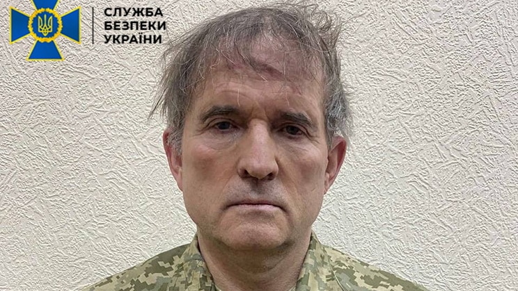 Pro-Russian Ukrainian politician Viktor Medvedchuk is seen in handcuffs dressed in military fatigues