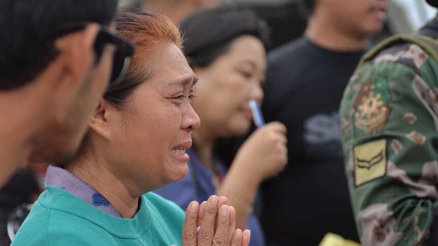 Grieving relatives wait for news of survivors after a ferry capsized in the central Philippines