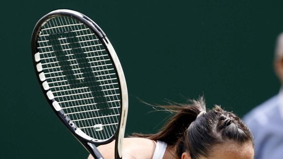 Huff and puff: Second seed Jelena Jankovic crashes out of Wimbledon leaving the title wide open.