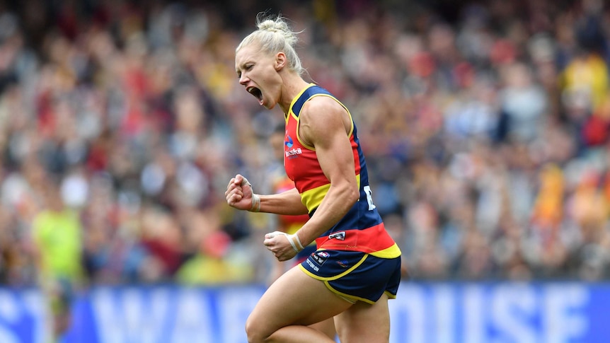 Erin Phillips clenches her fist and screams in delight