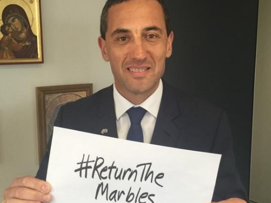 Tom Koutsantonis with a small sign saying return the marbles