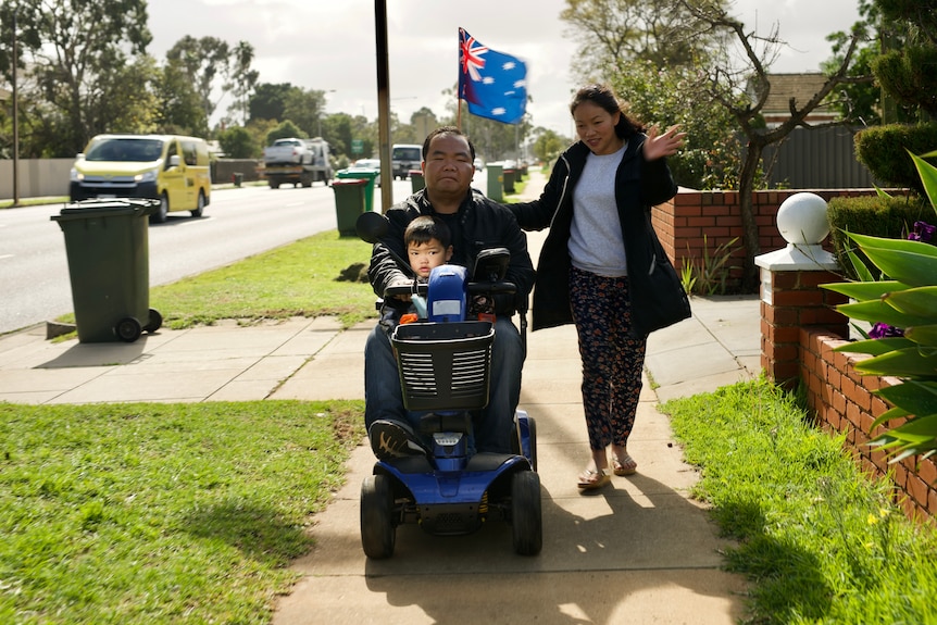 Kham Lian Mung in a mobility scooter in an Adelaide street.