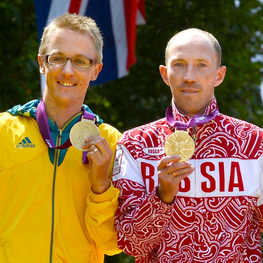 Jared Tallent and Sergey Kirdyapkin hold their medals on the podium at the London Olympic Games.