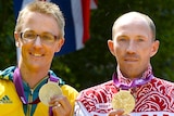 Jared Tallent and Sergey Kirdyapkin hold their medals on the podium at the London Olympic Games.