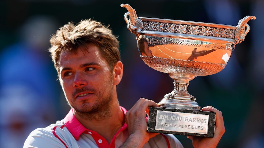 Swiss player Stan Wawrinka holds the French Open trophy after beating Novak Djokovic in the final.