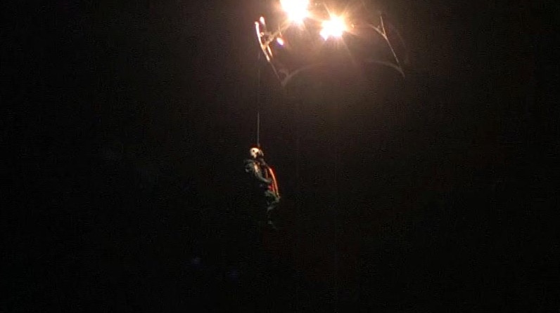 Rescue worker on a winch from a helicopter.