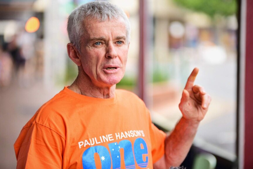 Malcolm Roberts speaking holding his finger up as he speaks