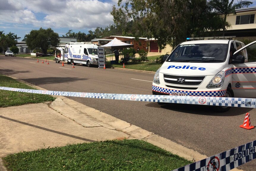 Police set up a crime scene in a suburban street in Queensland.