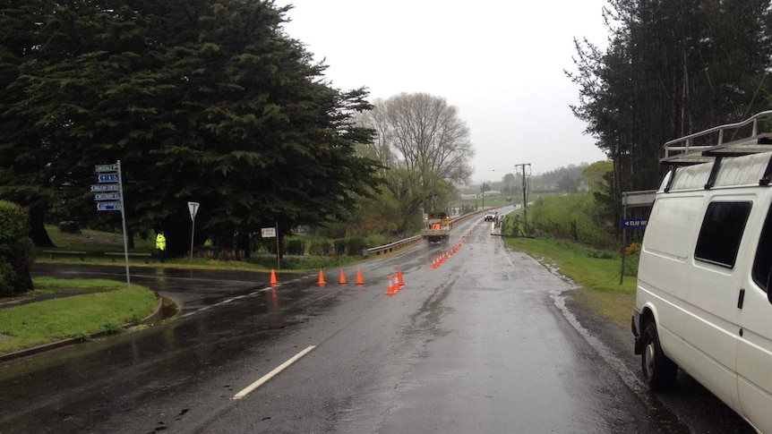 Power lines and trees block the road at Westbury