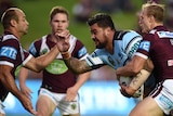 Andrew Fifita (centre) wears an armband with the letters FKL during a round 3 match in Sydney.
