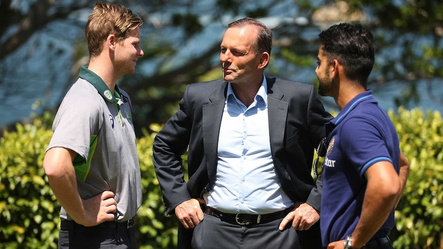 Australian captain, Steve Smith, Australian Prime Minister, Tony Abbott and Indian captain, Virat Kohli talk cricket