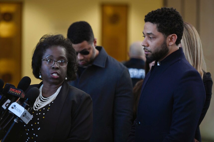 Actor Jussie Smollett, right, stands next to his attorney Patrica Brown Holmes during a news conference