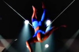 Spider-Man swings through the air
