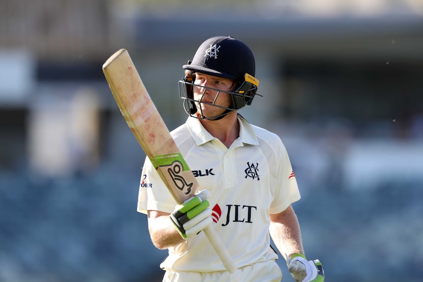 Will Pucovski raises his bat to acknowledge the crowd after his double century for Victoria