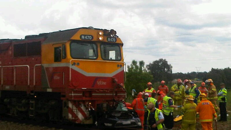 Emergency crews attend the scene after a car collided with V/Line train in West Wodonga.