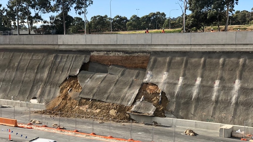 Concrete falling down of the side of a freeway