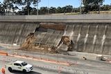 Concrete falling down of the side of a freeway