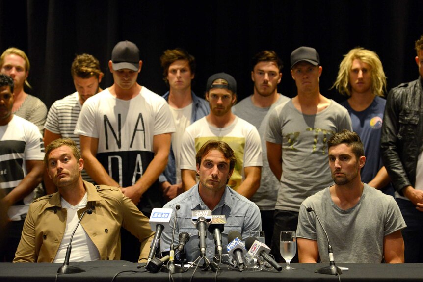 Essendon players, including Jobe Watson (C) during a press conference in Melbourne in March 2015.