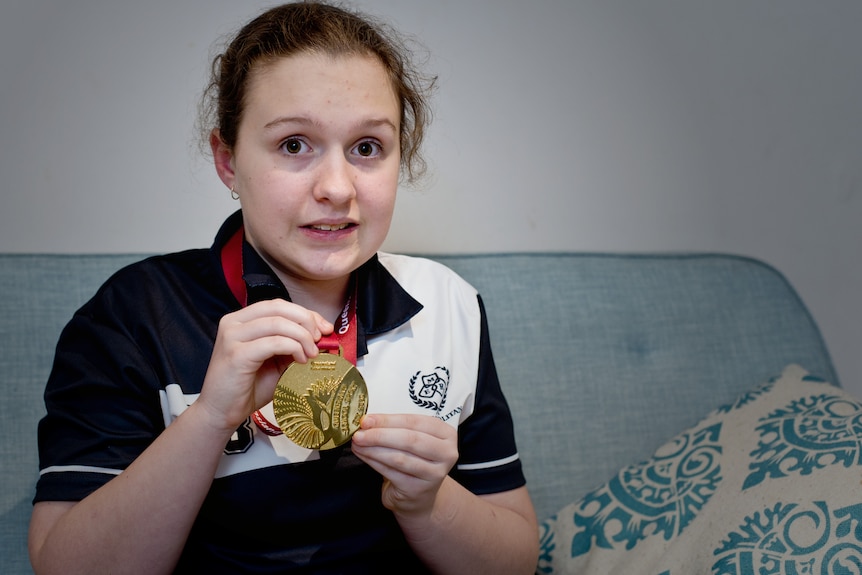 Charlotte Kanowski holds her medal